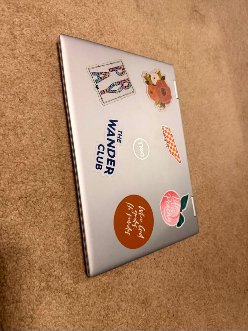 Dell Silver Laptop with Colorful Floral and Graphic Stickers